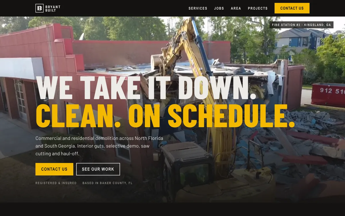 The Bryant Built homepage on a computer: drone video of an excavator taking down a building, with the headline We take it down. Clean. On schedule.